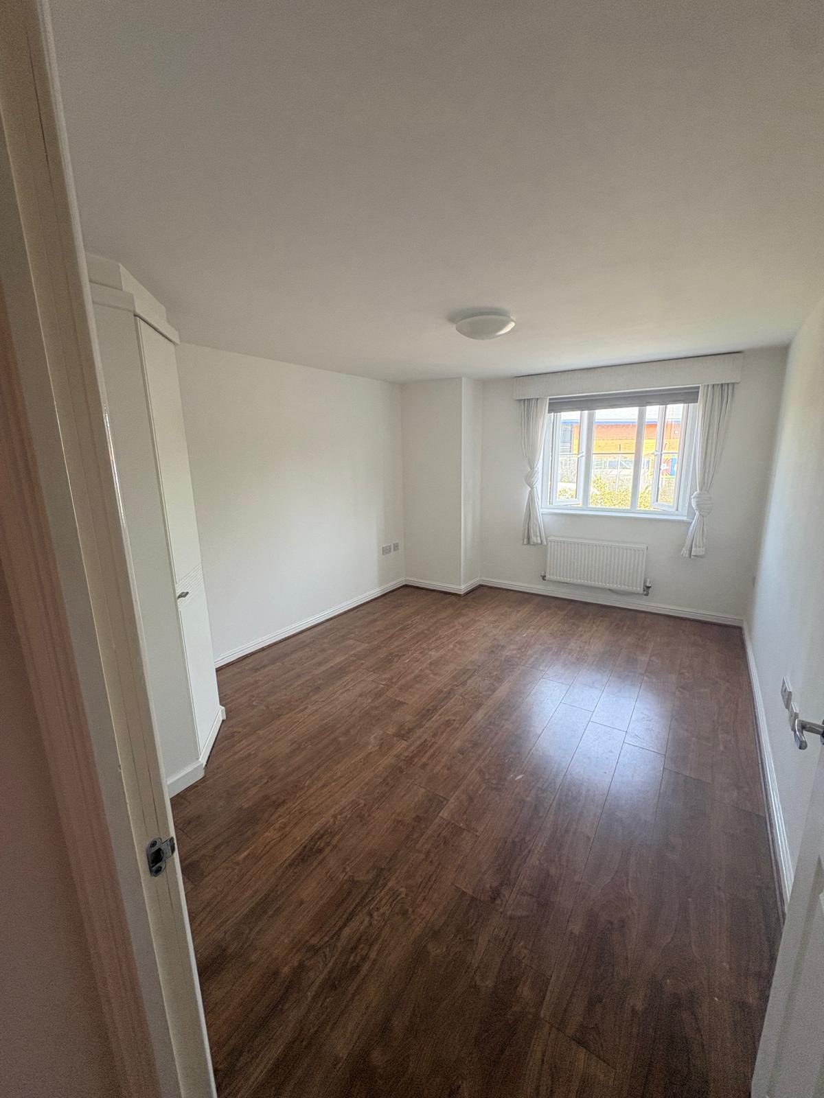 Bedroom of the completed residential flat with fitted wardrobe